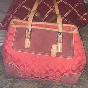 Coach women’s handbag pretty reddish orange color